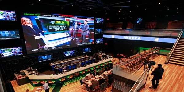 The Mecca Sports Bar and Grill, the ultimate bar across from Fiserv Forum, encompasses a 38-foot screen that spans a pair of floors